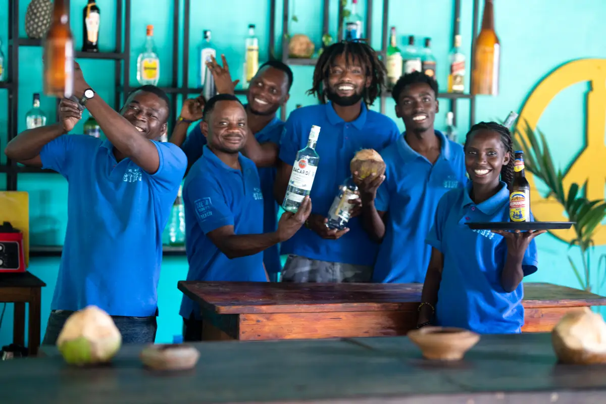 new teddy's staff group photo behind the bar